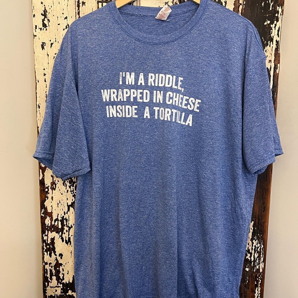 NWOT “I’m A Riddle Wrapped In Cheese Inside A Tortilla”. Funny unisex T-shirt.